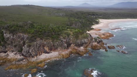 headland and ocean, fingal beach in nsw, australia - drone shot
