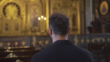 Man-sitting-in-church.