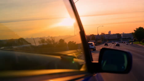 Driving into the sunset on the highway