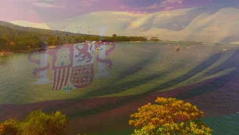 animation of flag of spain blowing over okay hands on beach landscape