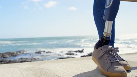 low section of disabled woman standing near railing on sunny day 4k