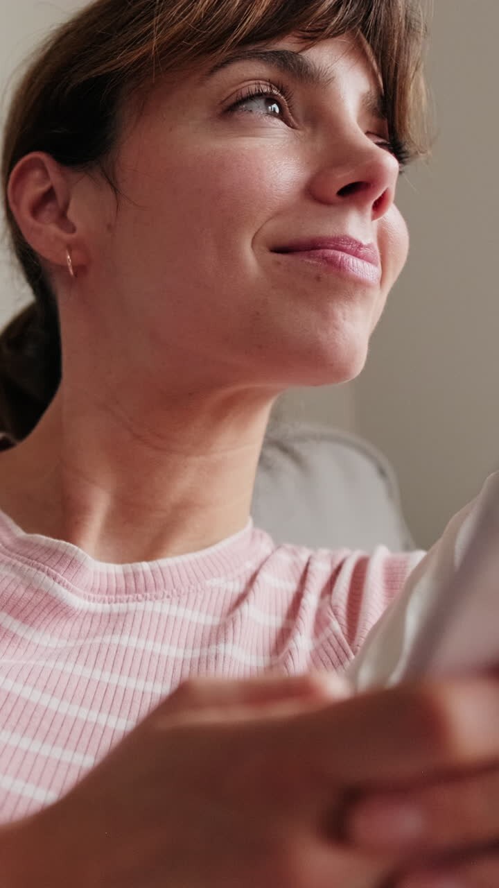 Happy Woman Using Phone At Home