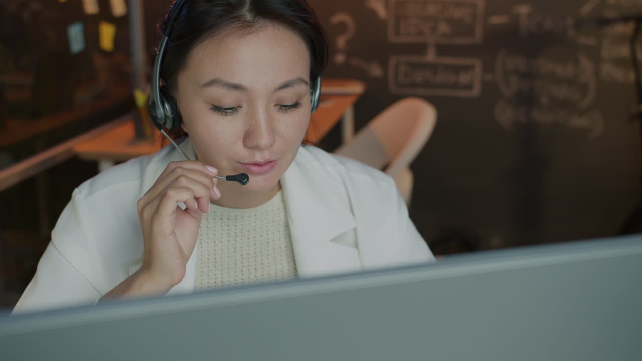 Asian Woman Working from Home as a Customer Service Representative