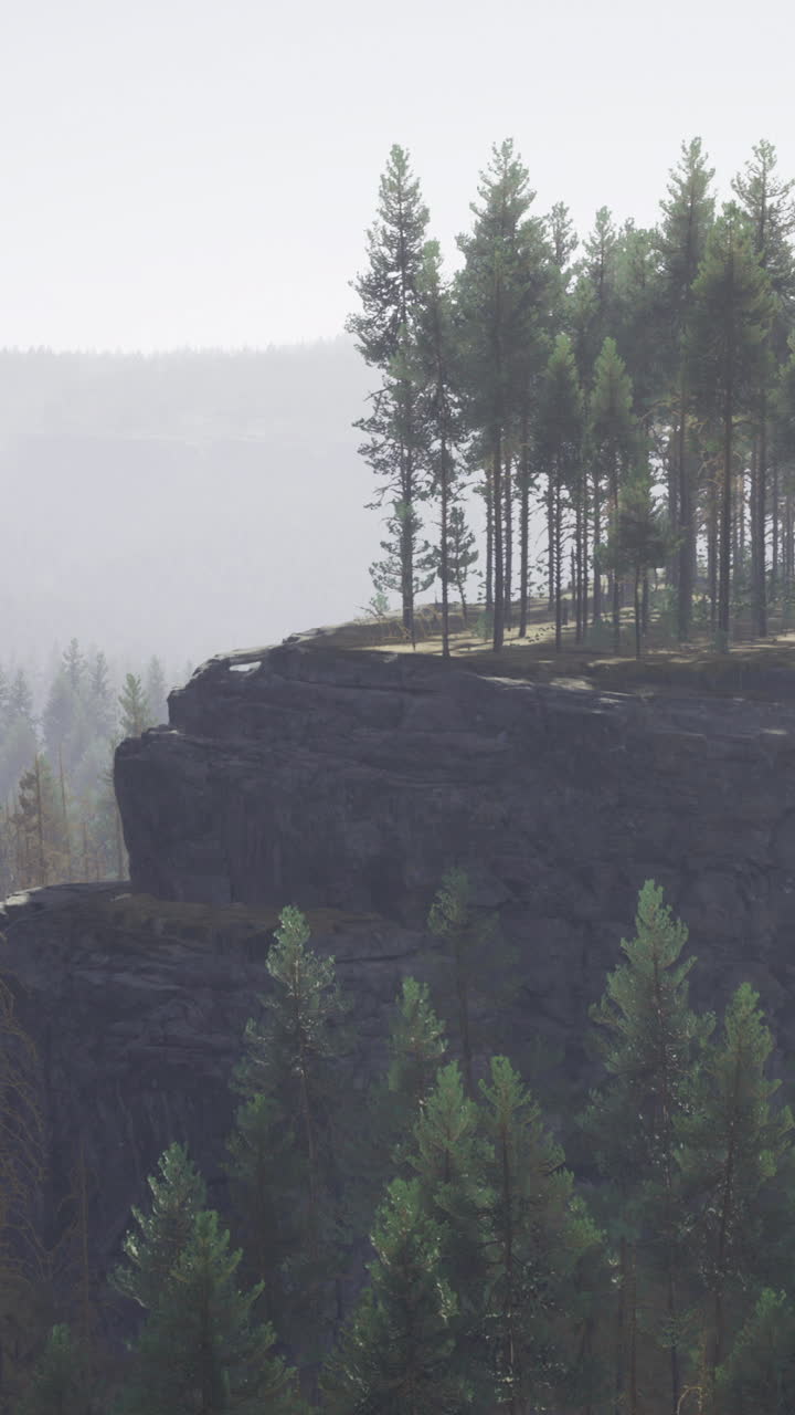 Majestic rocky outcrop crowned with lush trees under a serene morning sky