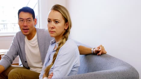 Man-and-woman-upset-with-each-other-in-living-room