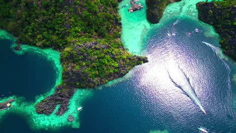 kayangan lake high up drone pan down to tour boats