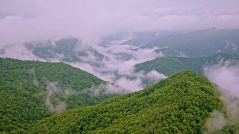 aerial footage of mist rolling through ancient appalachian ridges
