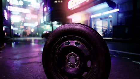 urban landscape featuring a discarded tire under neon lights at night