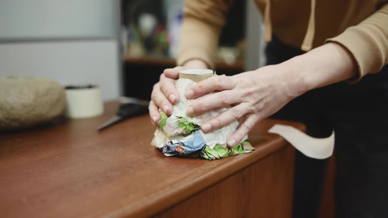 Caucasian Hands Testing Recycled Packaging Prototype On Countertop, Closeup Of Woman Pressing And Adjusting . Media