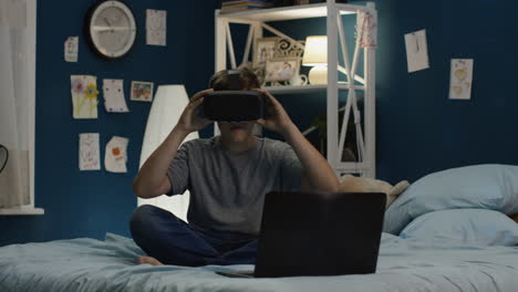 boy wearing vr headset in his bedroom