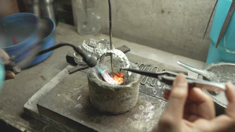 jeweler at work in jewelry. desktop for craft jewelry making with professional tools. close up view of tools. thailand.