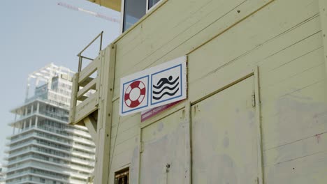 lifeguard station on the beach - signs on wooden walls - tel aviv