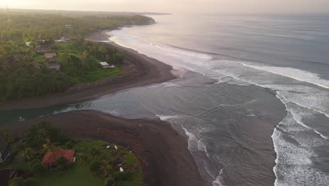 balian surfers beach with blue green waves swelling along the shoreline