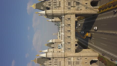 Vertical-format:-Maintenance-crew-works-on-replica-Tower-Bridge,-China