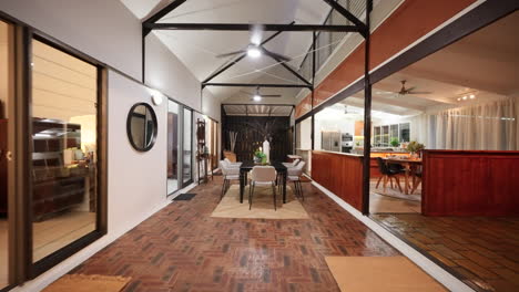 tropical kitchen table reverse dolly to living room with large open space of balinese style house