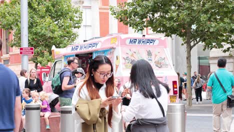 people enjoying ice cream outside museum in london