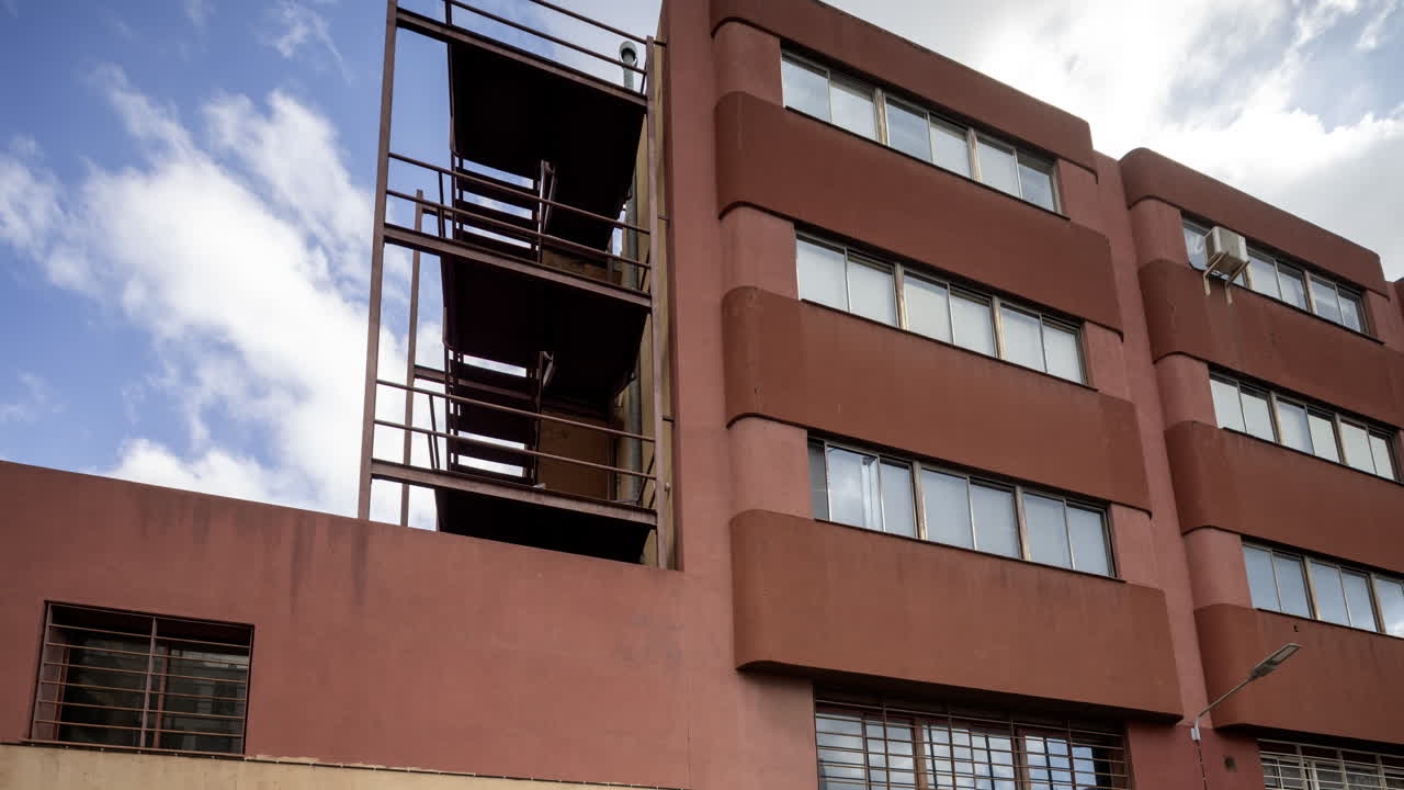 Old factory and industrial complex with passing clouds