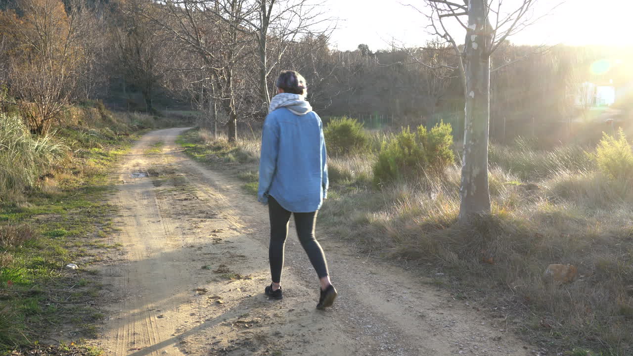 Traveler walks during a beautiful sunset in the mountains