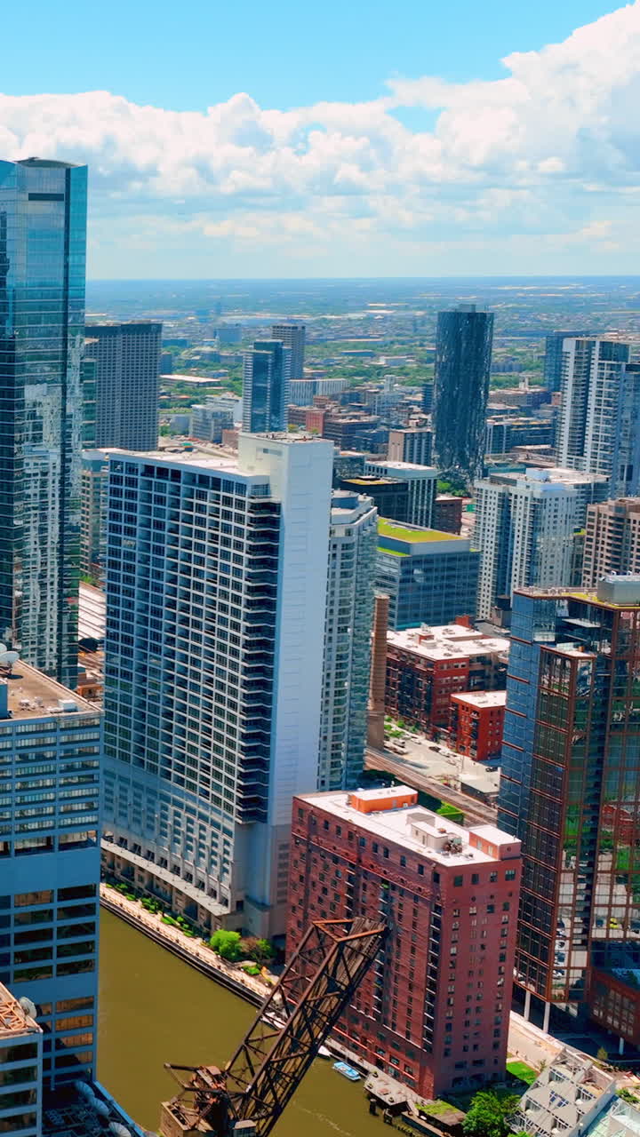 Chicago downtown cityscape with Chicago River at sunny day. Aerial view. Vertical video