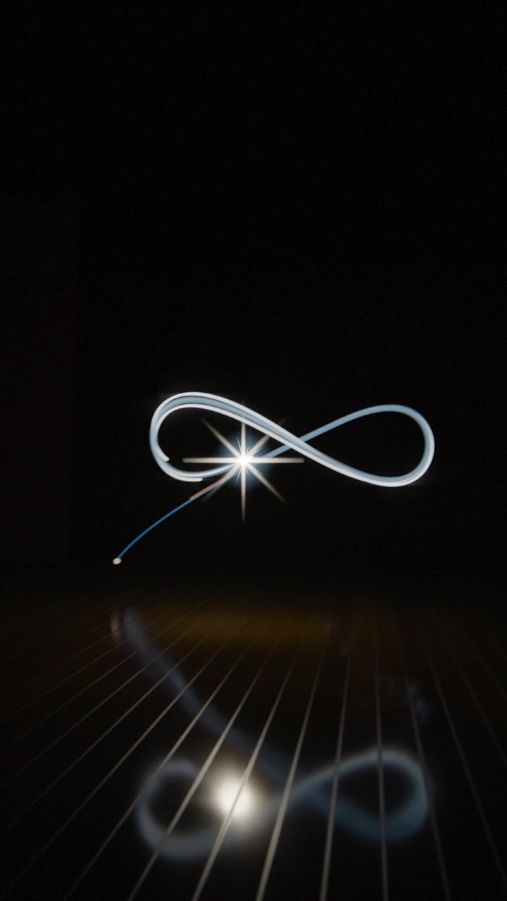 Vertical video: Making dot into star over studio floor tracing ribbon forming rings mirroring stand