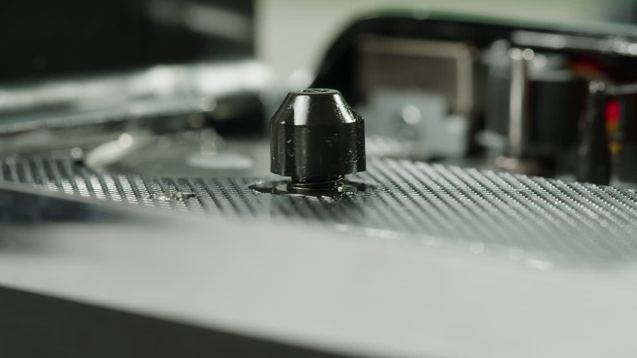 Close-up of a vintage audio cassette tape showing wear marks and magnetic tape reels in retro style.