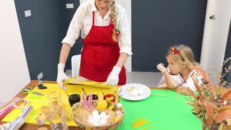 mother and daughter easter egg decorating