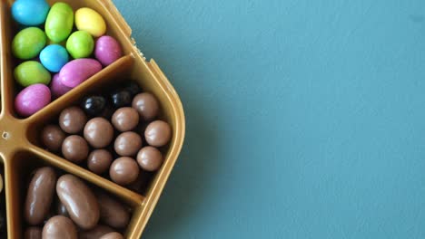 assorted candies in a gold container