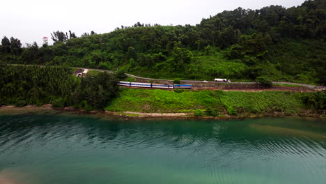 train traveling from da nang to hue in vietnam - aerial drone shot