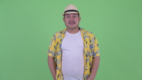 young handsome overweight asian tourist man