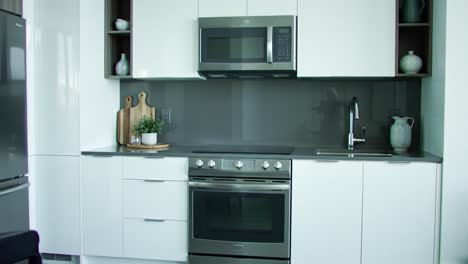 modern kitchen interior design featuring sleek white cabinets, contemporary appliances, and stylish decor elements for a sleek culinary experience