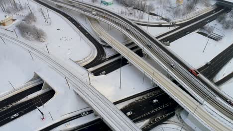 aerial view of a freeway intersection snow-covered in winter.