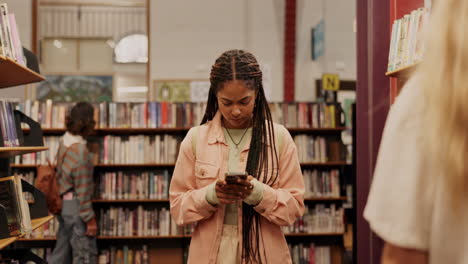 people browsing books in a library