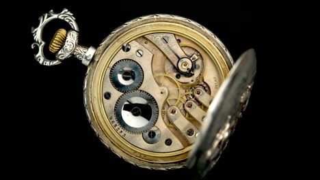 open antique pocket watch mechanism