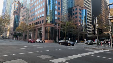 busy intersection with vehicles and pedestrians