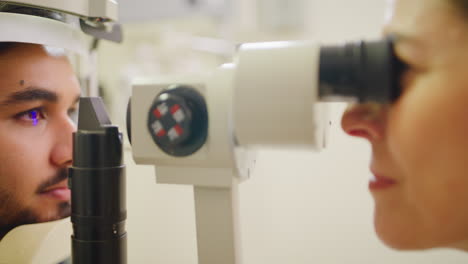 Optometrist-doing-an-eye-test-on-a-patient