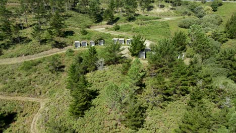 Aerial-drone-footage-of-a-modern-graveyard-in-the-middle-of-the-forest-in-Finisterre