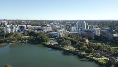 Aerial-view-of-apartments-residential-neighborhood-properties-over-the-river-and-highway-in-Sydney,-Australia