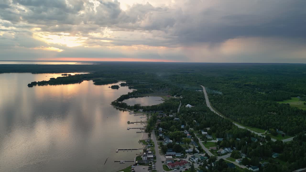 Aerial sunset view of hessel michigan coastline and dramatic clouds, Les Cheneaux Islands, Michigan