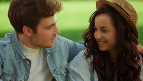 beautiful couple spending time on picnic. guy hugging girl in park