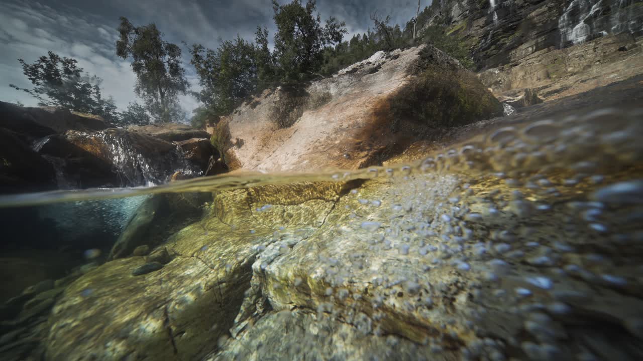 An enchanting over-under view unveils the rivers's rocky terrain