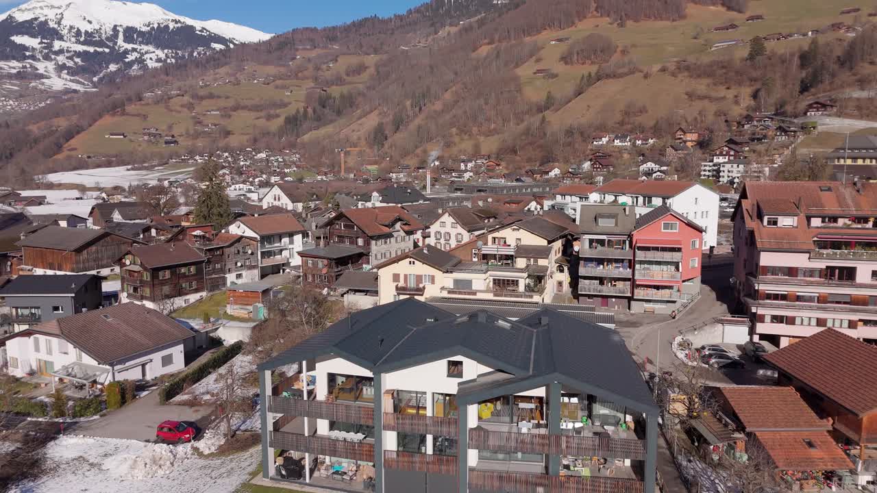 Schiers, switzerland, featuring alpine houses, snow, and mountains , aerial view