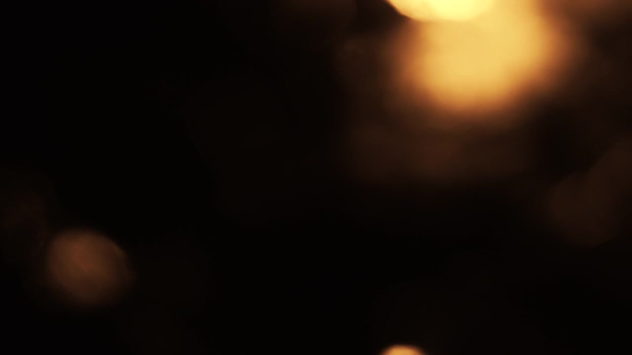 Kebocoran Cahaya Emas Abstrak dan Hamparan Bokeh