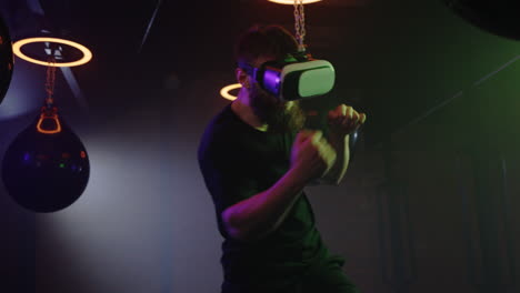 man wearing vr headset boxing in a gym