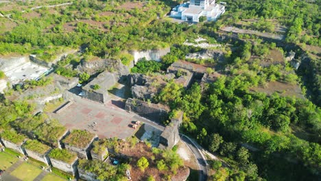 Aerial-view-of-Bali-Patung-Garuda-Wisnu-Kencana-statue-and-lush-Indonesian-landscape