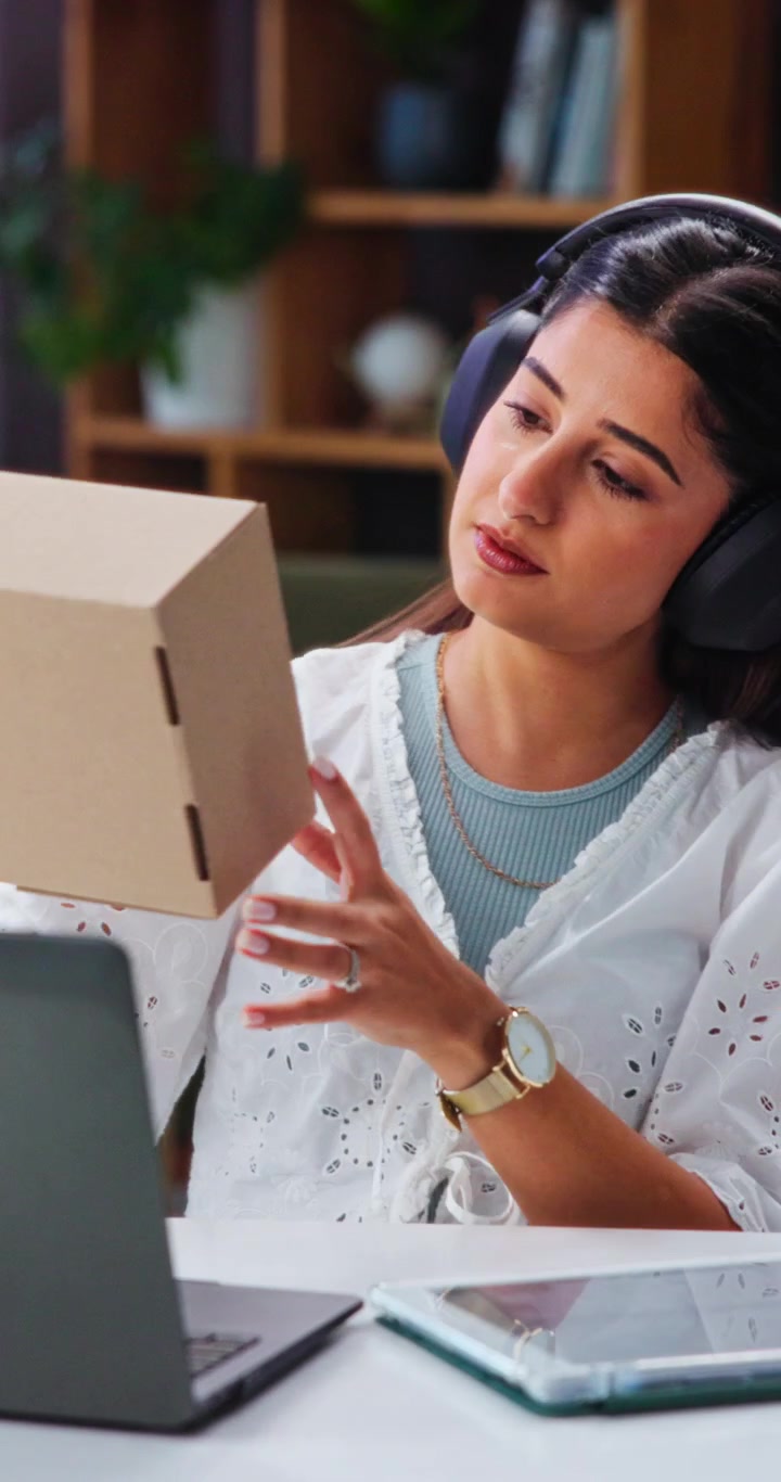 Young Woman Working on Laptop and Tablet in Home Office