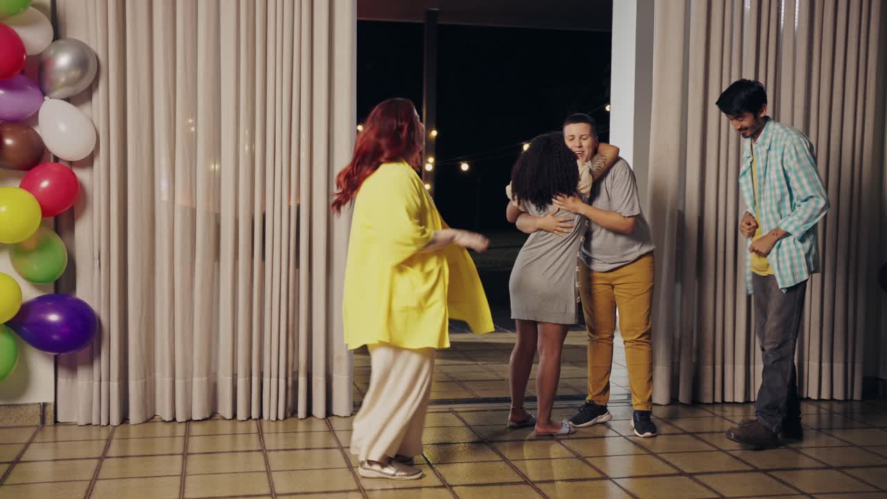 Friends Socializing and Celebrating at an Indoor Party