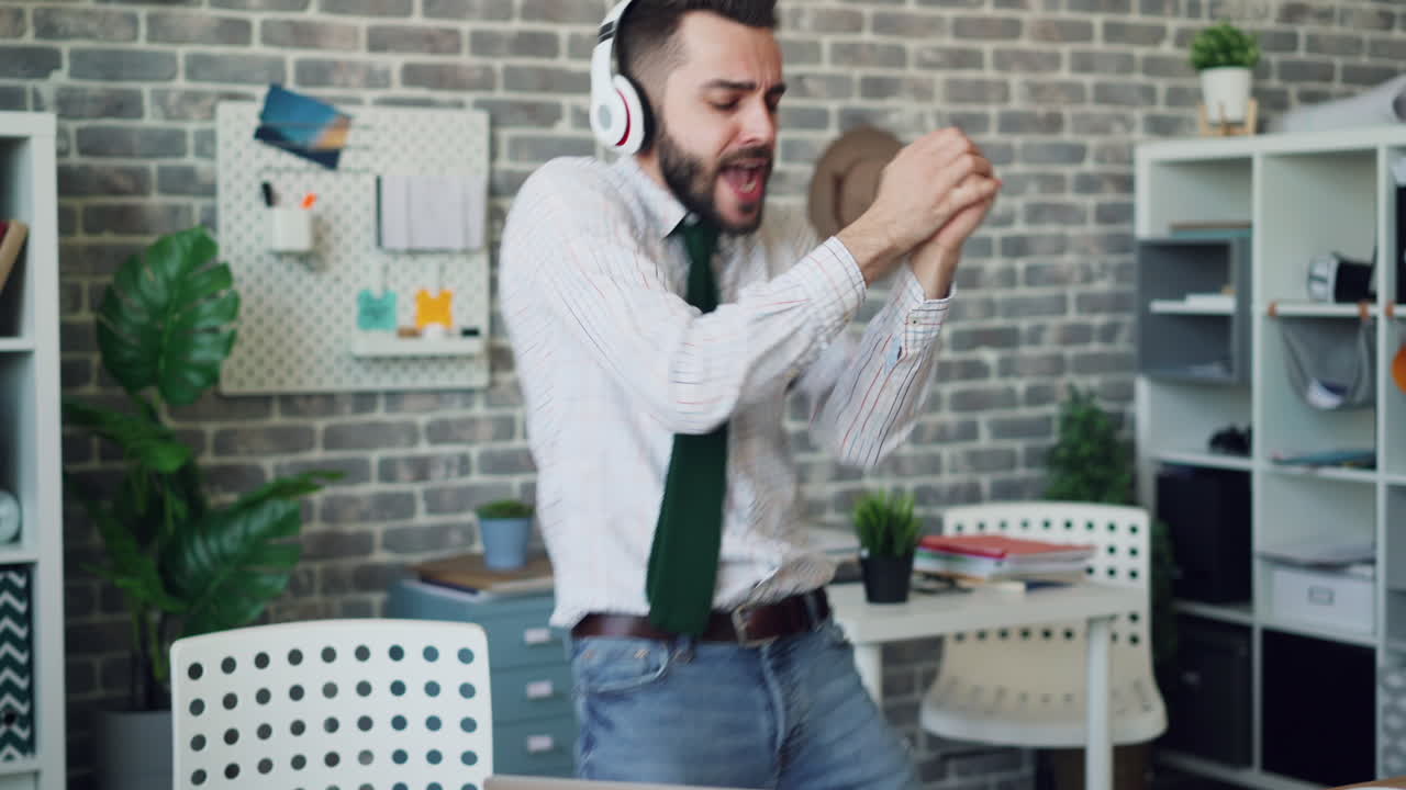 Happy Businessman Dancing in Office