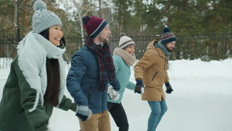 friends ice skating in winter