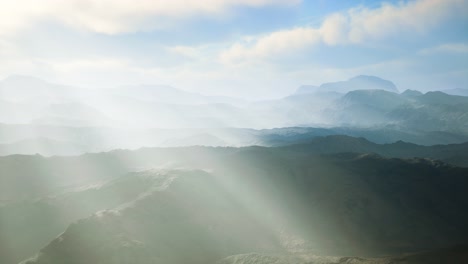 aerial vulcanic desert landscape with rays of light