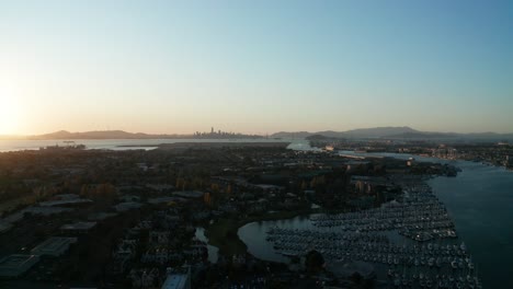 A distant city revealed in the fog of the sunset